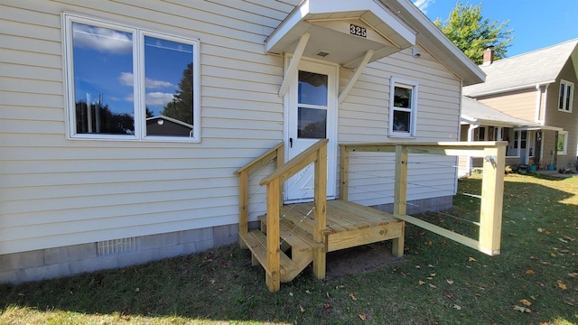 wooden deck featuring a yard