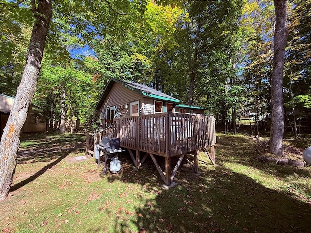 back of property featuring a deck