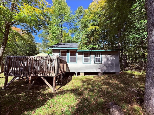 back of house with a wooden deck