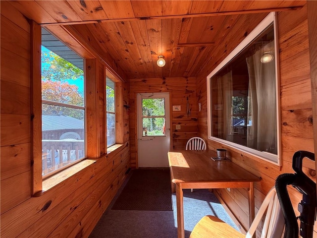 sunroom featuring wood ceiling