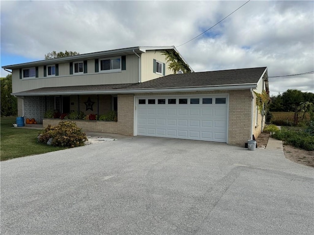 front facade with a porch and a garage