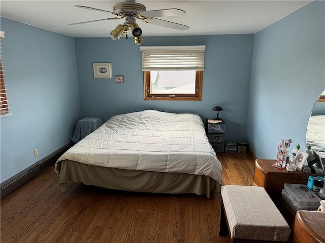 bedroom with wood-type flooring and ceiling fan