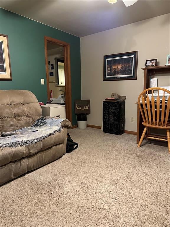 living room featuring carpet flooring and ceiling fan