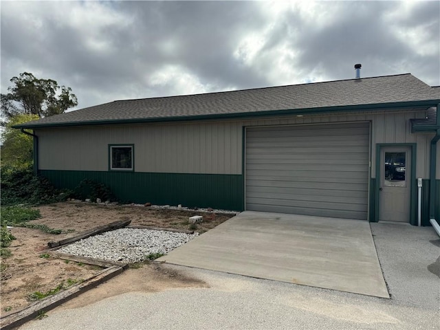 garage featuring wooden walls