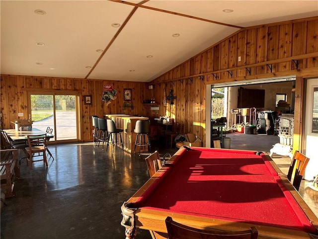 rec room with vaulted ceiling, pool table, and wood walls