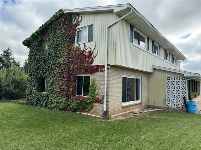 view of property exterior with a lawn