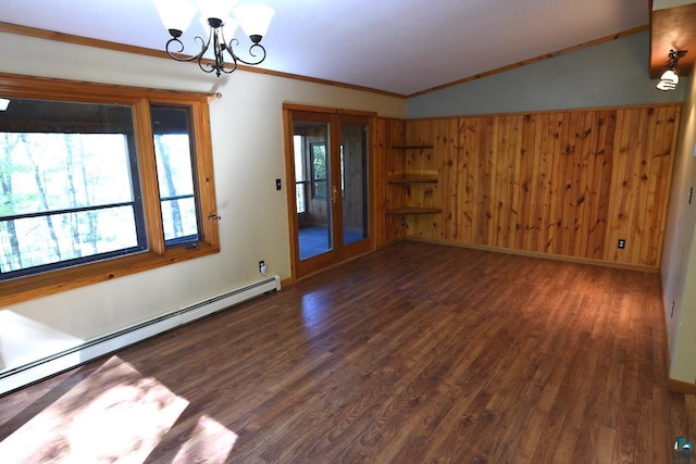 empty room with wooden walls, vaulted ceiling, dark wood-type flooring, and a healthy amount of sunlight