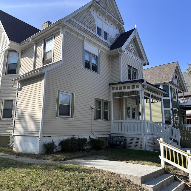 view of property exterior with a lawn