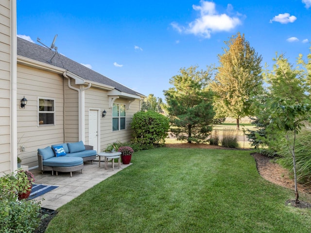 view of yard featuring an outdoor living space and a patio area