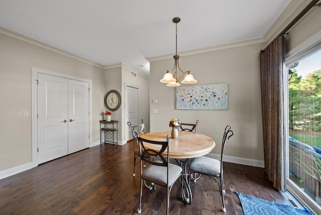 dining space with ornamental molding, a chandelier, and dark hardwood / wood-style flooring