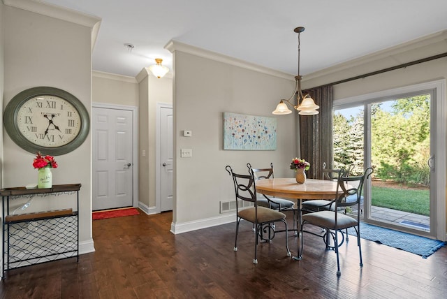 dining space featuring a chandelier, dark wood-type flooring, and crown molding