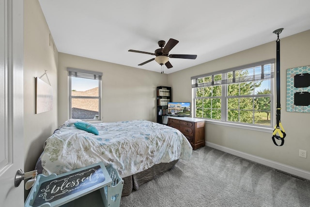 carpeted bedroom featuring ceiling fan