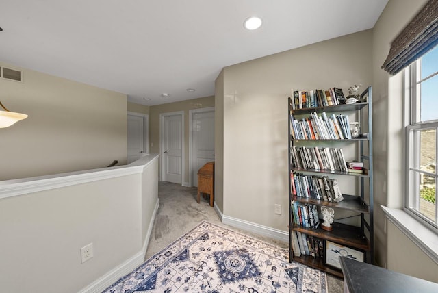 interior space featuring light colored carpet