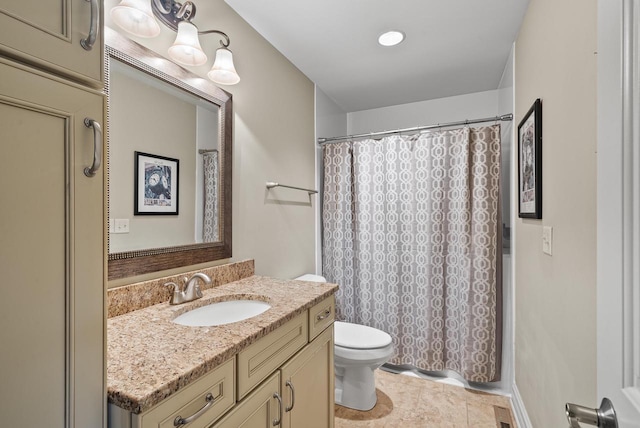 bathroom featuring a shower with curtain, vanity, toilet, and tile patterned floors