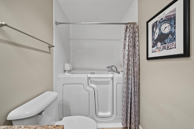 bathroom featuring separate shower and tub and toilet