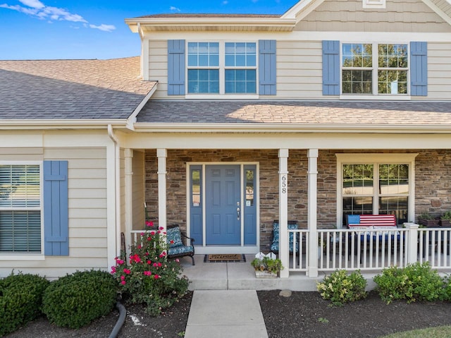 property entrance featuring covered porch