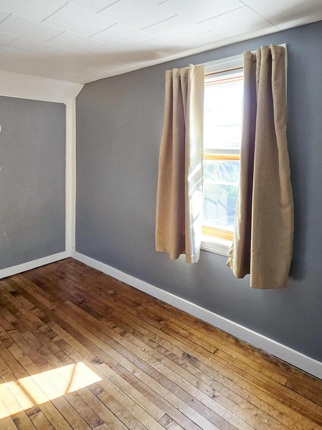 unfurnished room featuring hardwood / wood-style floors