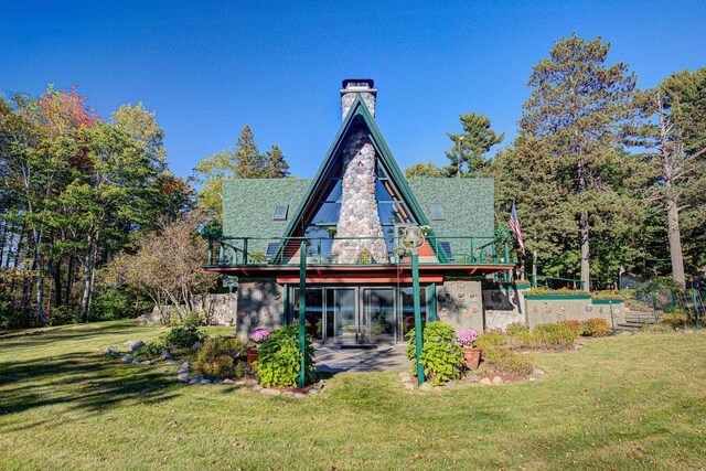 6147 County Rd E, Phelps, WI 54554 - back of property with a yard and a chimney