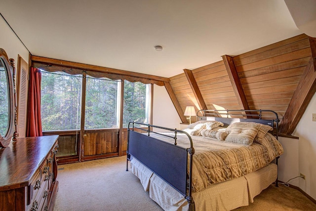 carpeted bedroom featuring wooden ceiling, multiple windows, and vaulted ceiling with beams