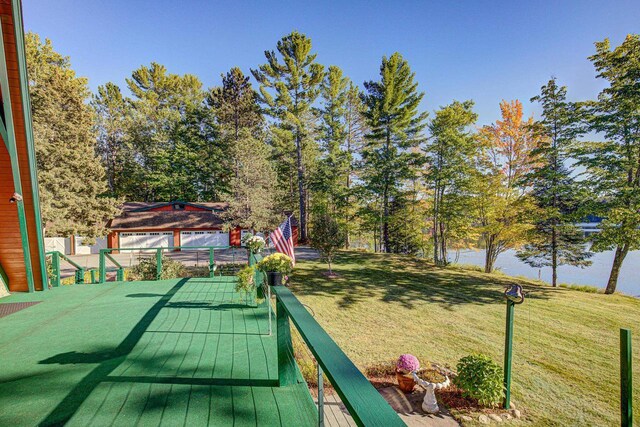 6147 County Rd E, Phelps, WI 54554 - wooden deck featuring a lawn and a water view