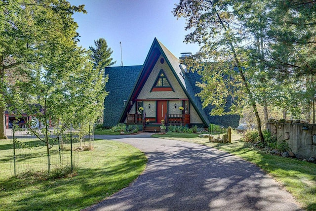 6147 County Rd E, Phelps, WI 54554 - a-frame home featuring roof with shingles, fence, a front lawn, aphalt driveway, and a chimney