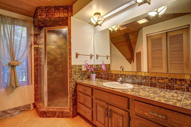 6147 County Rd E, Phelps, WI 54554 - bathroom featuring vanity, wood ceiling, and a stall shower