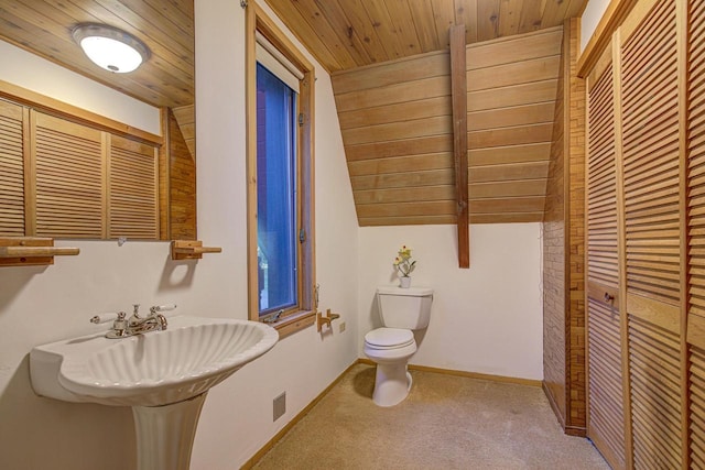 bathroom with toilet, wood ceiling, and lofted ceiling