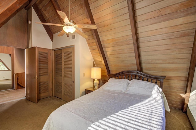 bedroom featuring light carpet, wood ceiling, ceiling fan, a closet, and lofted ceiling with beams