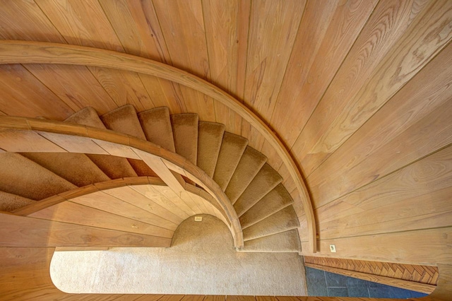 staircase with wood ceiling