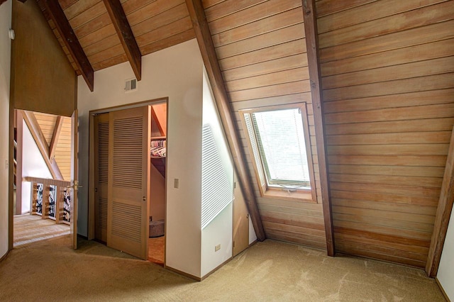 bonus room featuring light carpet, wood ceiling, wood walls, and vaulted ceiling with beams