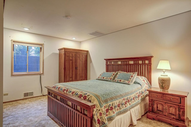 bedroom with light colored carpet