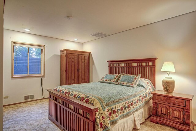 6147 County Rd E, Phelps, WI 54554 - bedroom with recessed lighting, baseboards, visible vents, and light carpet