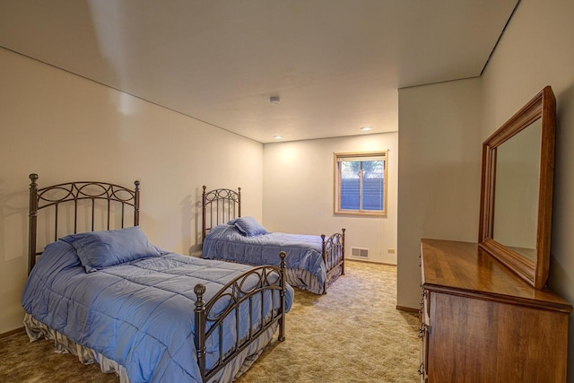 6147 County Rd E, Phelps, WI 54554 - bedroom with visible vents, baseboards, and light carpet