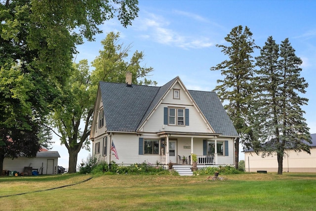 view of front of property with a front lawn and covered porch