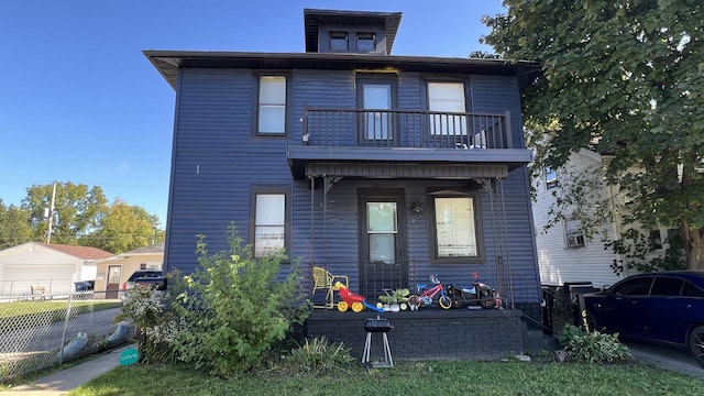 rear view of house with a balcony