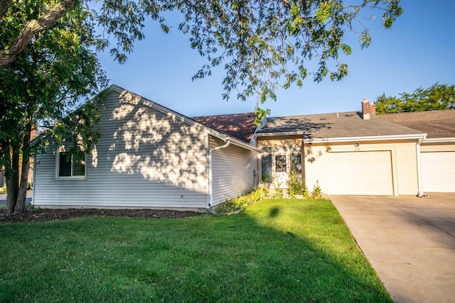 single story home with a garage and a front yard