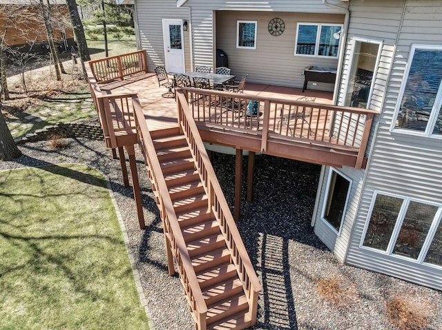1516 E Orchard Beach Ln, Rice Lake, WI 54868 - wooden deck featuring stairs and outdoor dining space
