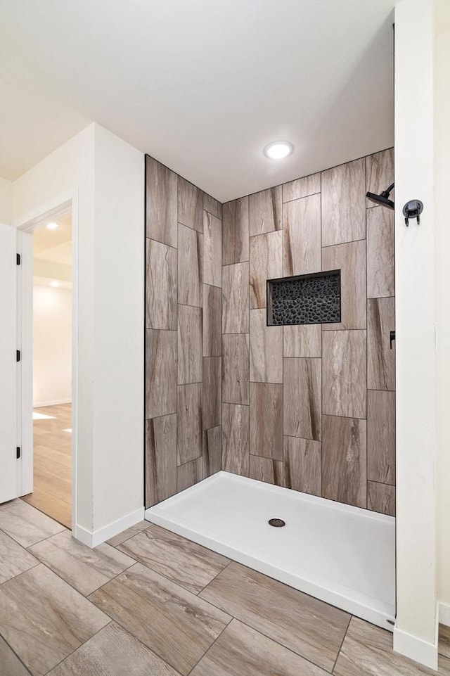 bathroom with a tile shower