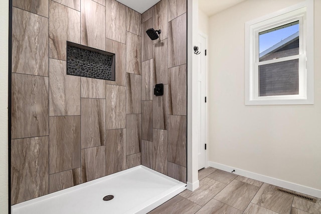 bathroom featuring tiled shower