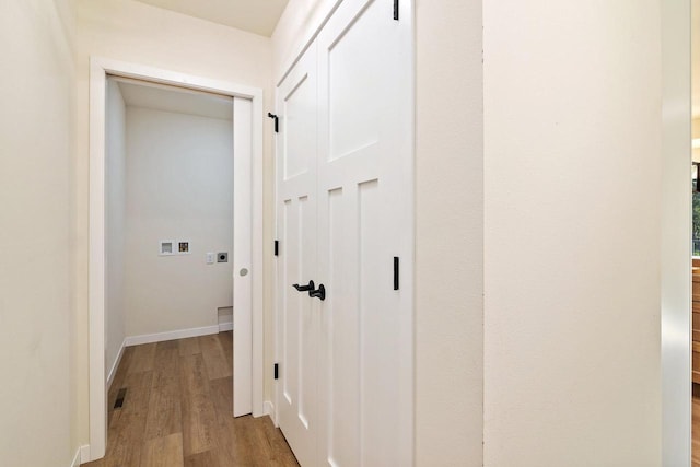 corridor featuring light hardwood / wood-style flooring