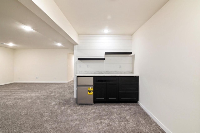 kitchen with light carpet