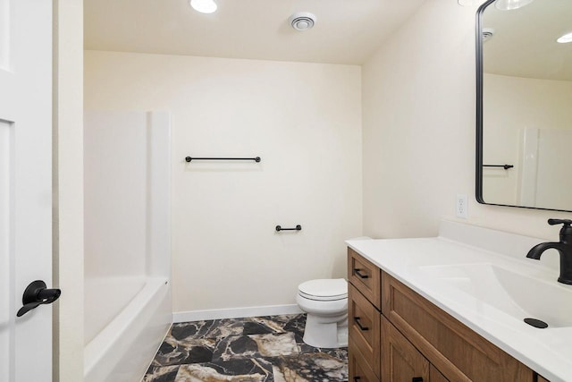 bathroom with toilet and vanity