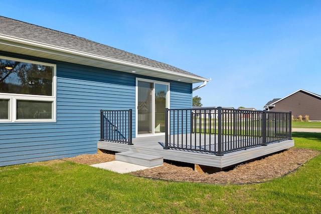 wooden deck featuring a yard