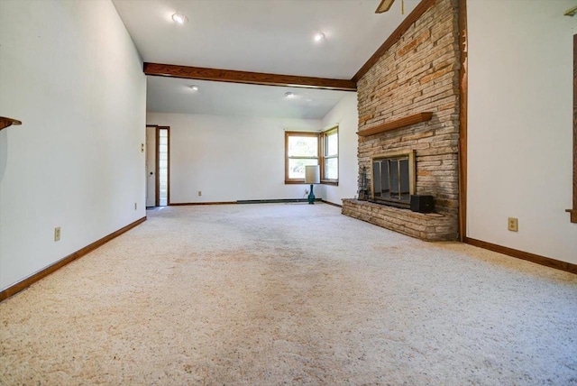 unfurnished living room with carpet, a stone fireplace, and lofted ceiling with beams