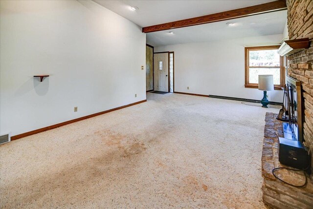 2809 Dewey Ct, Middleton, WI 53562 - unfurnished living room featuring carpet floors, beam ceiling, a fireplace, baseboards, and visible vents