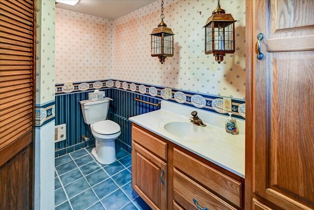 2809 Dewey Ct, Middleton, WI 53562 - bathroom featuring wallpapered walls, vanity, toilet, and tile patterned flooring