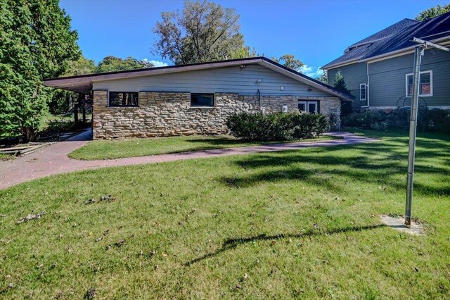 2809 Dewey Ct, Middleton, WI 53562 - view of side of home with stone siding and a lawn