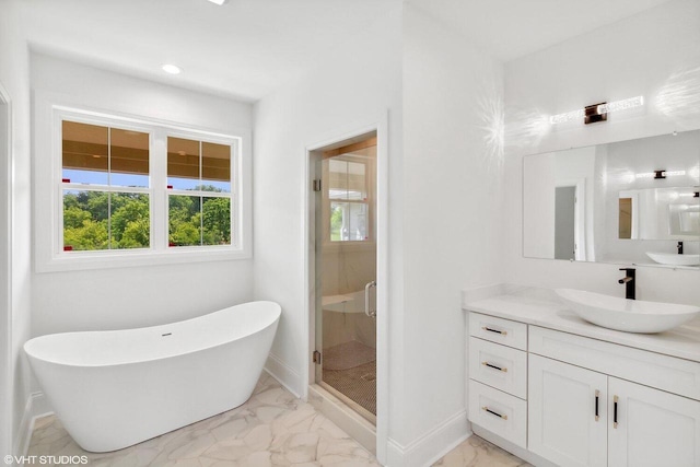 bathroom featuring vanity and shower with separate bathtub