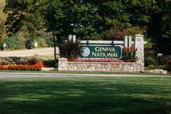 community / neighborhood sign featuring a lawn