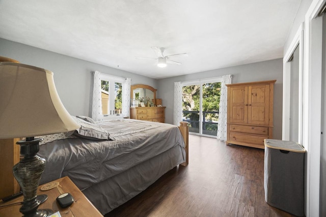 bedroom with multiple windows, dark hardwood / wood-style floors, access to exterior, and ceiling fan